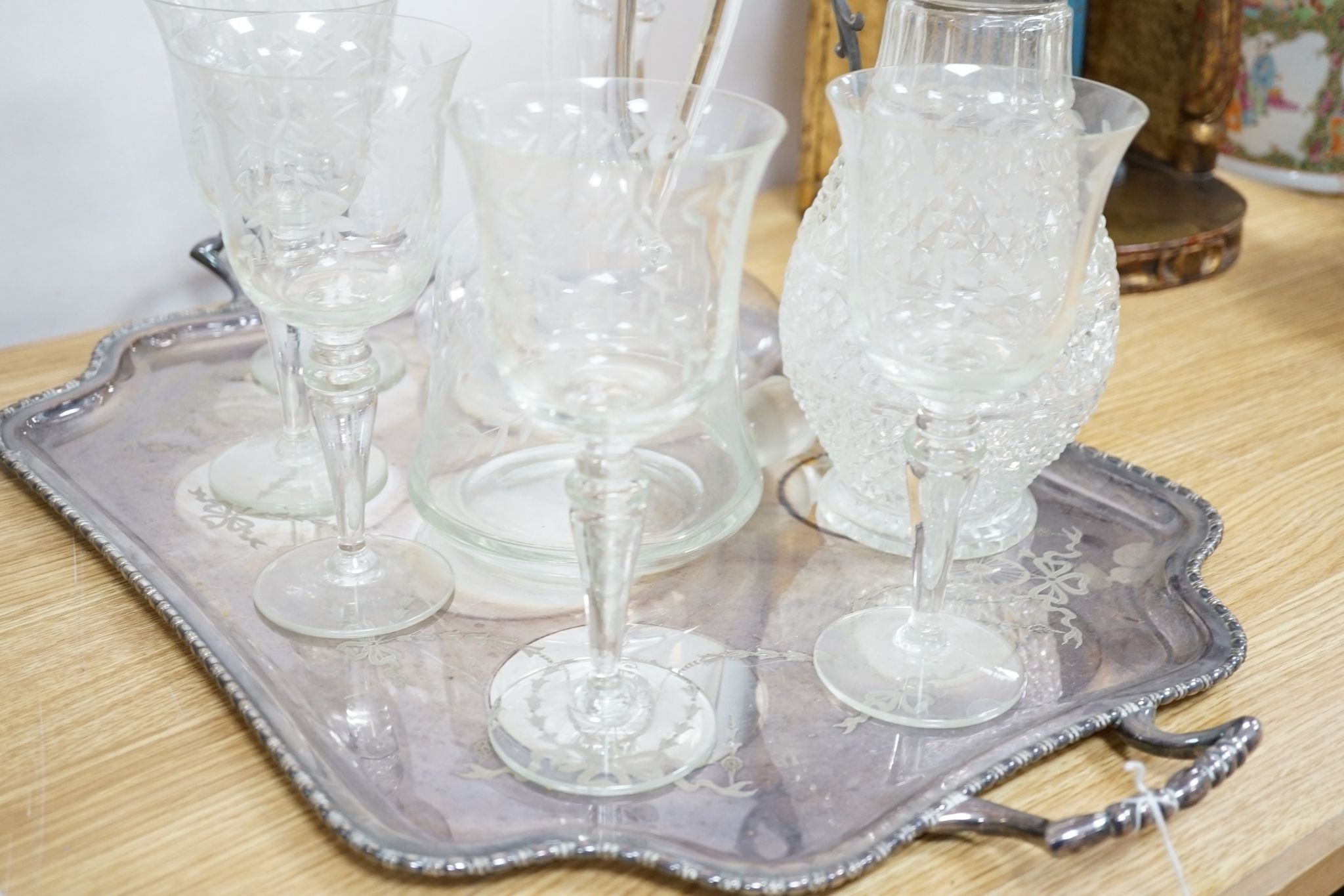 A plated two handled tea tray, a claret jug, two decanters and five glasses (9)